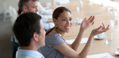 People having discussion at conference table